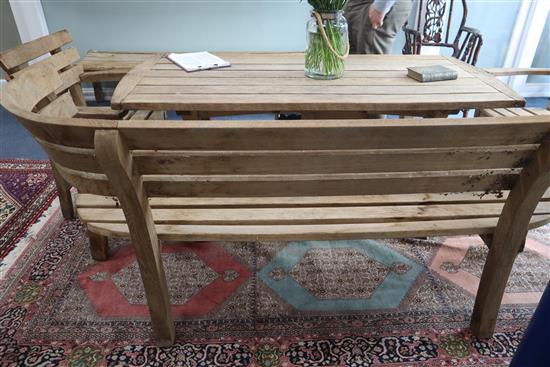 Gaze Burvill. An oak garden table, bench, low bench and pair of chairs Table L.170cm, Bench L.210cm, Low bench L.195cm